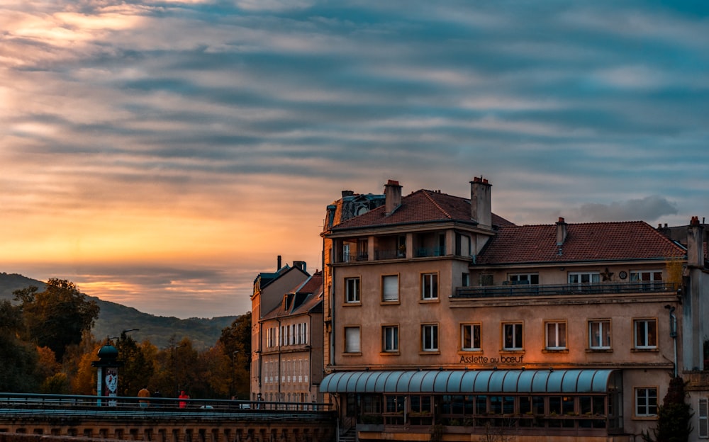 brown and white concrete building during sunset