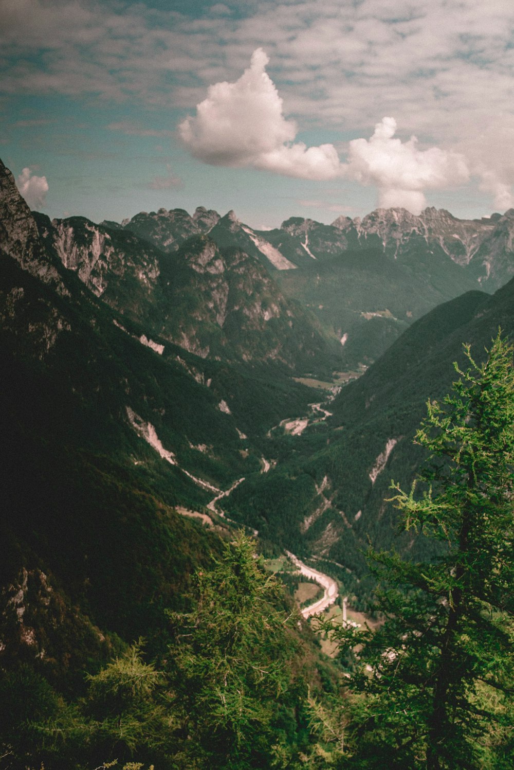 green mountains under white clouds during daytime