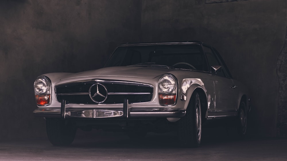 white mercedes benz coupe in a tunnel