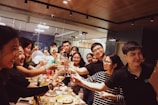A diverse group of professionals celebrating job success.