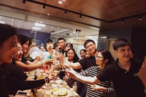 Team celebrating successful project launch in a bright office.