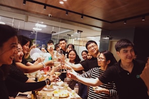 A group of entrepreneurs happily celebrating a milestone in the accelerator office