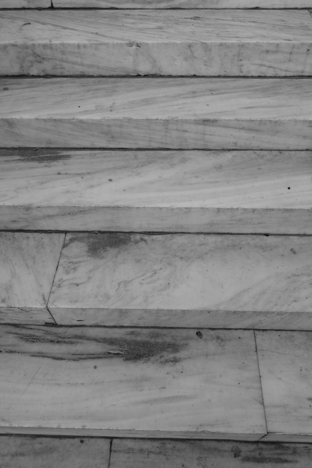 grayscale photo of wooden floor