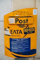Close-up of secure mailboxes labeled for tax domiciles in Greece and abroad.