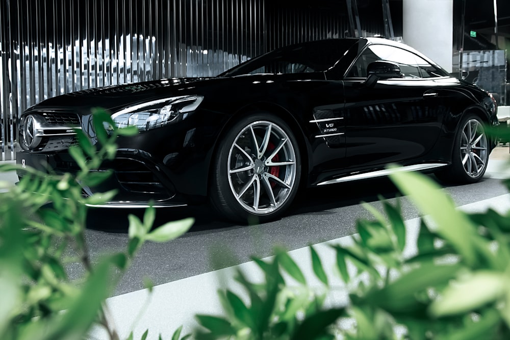 black porsche 911 parked on parking lot