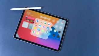 black tablet computer on black table