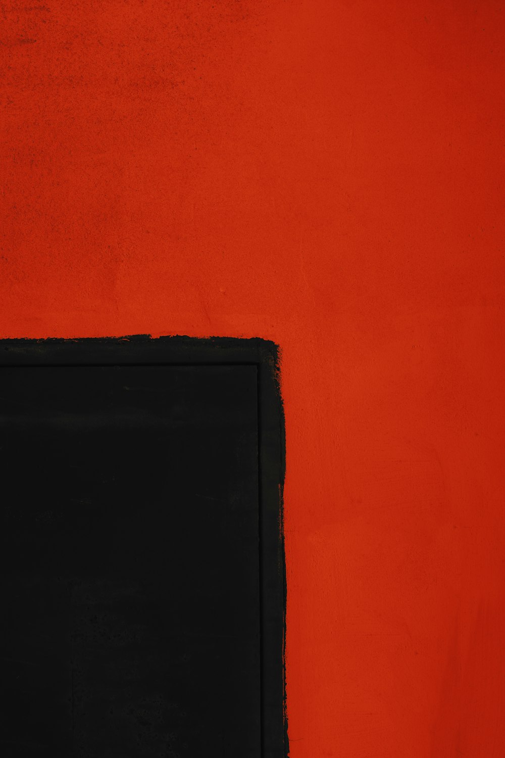 black textile on orange wall