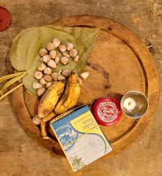An inviting arrangement of dry fruits and jaggery blocks on a woven tray.