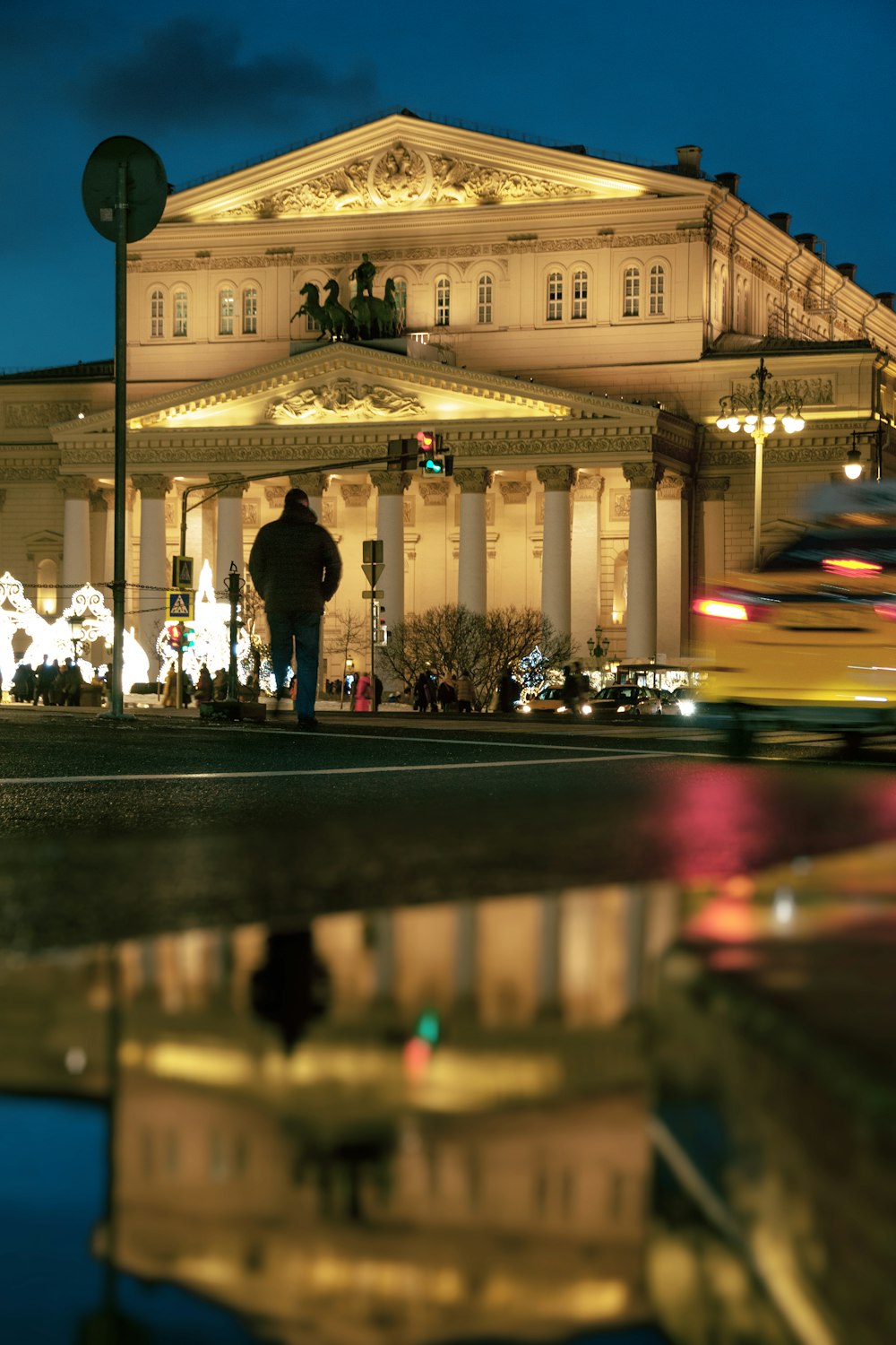 people walking on street during night time