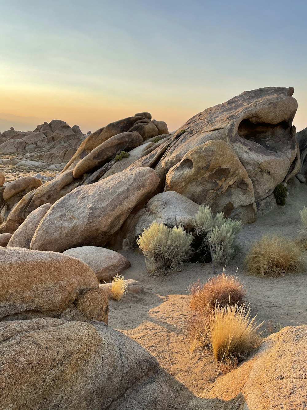 brown rock formation under white sky during daytime