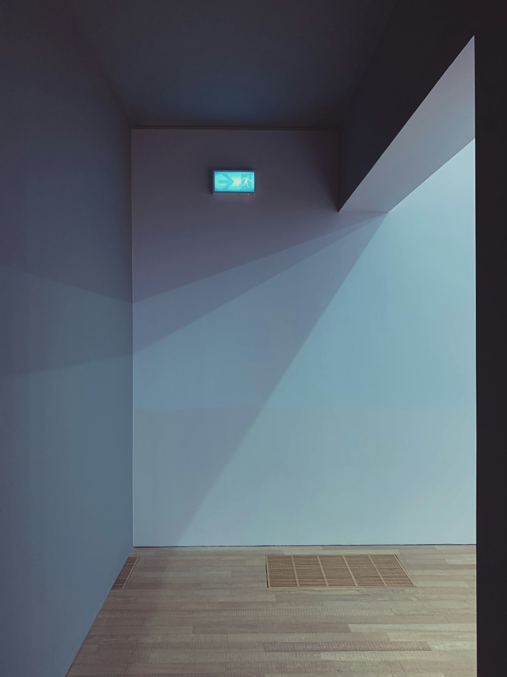 a room with a blue wall and a wooden floor