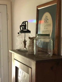 Victorian cabinet drawer open, revealing neatly arranged ritual objects in jewel tones