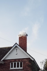 brown and white concrete house under white sky during daytime
