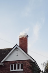 brown and white concrete house under white sky during daytime