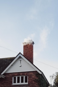 brown and white concrete house under white sky during daytime