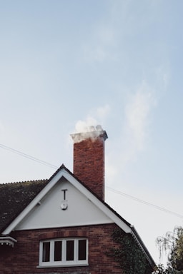 brown and white concrete house under white sky during daytime