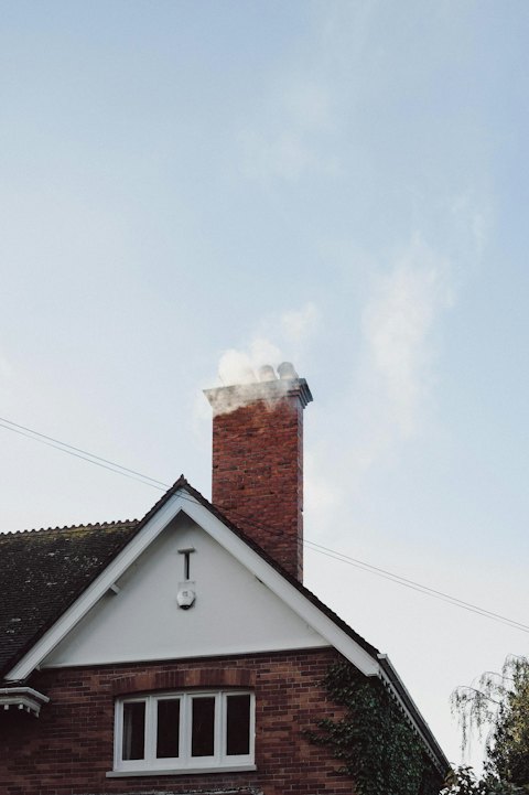 Chimney cap installation preventing water damage and animal entry on Seattle home