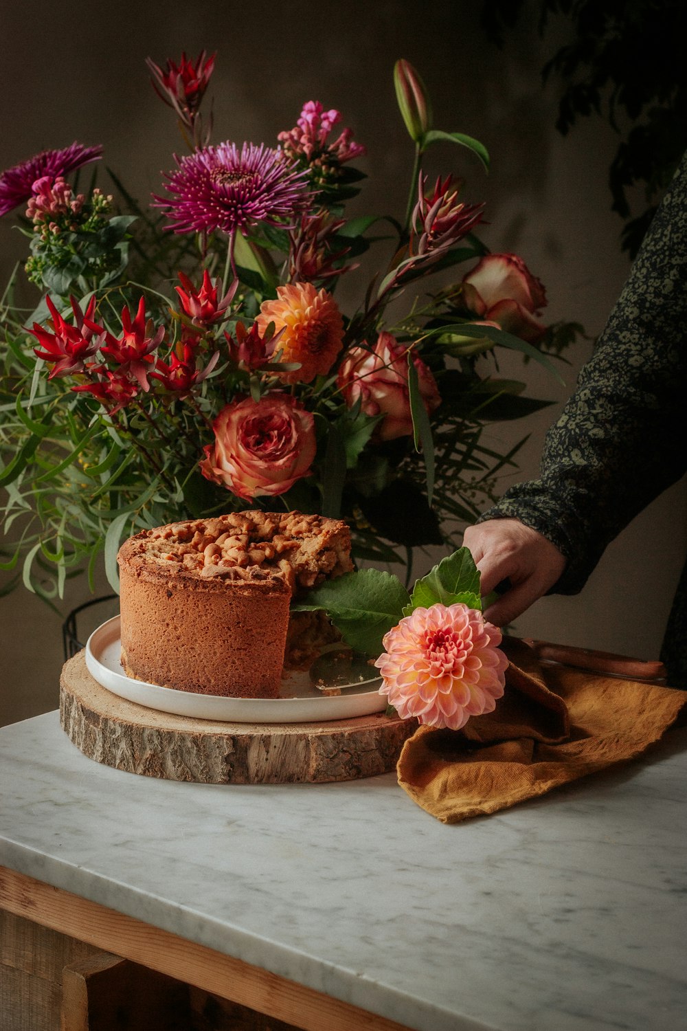 pink and yellow flowers on brown wooden table