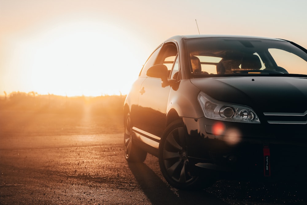 black volkswagen golf on road during sunset