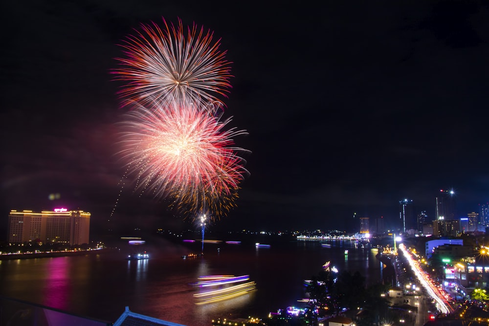 red and yellow fireworks display during nighttime