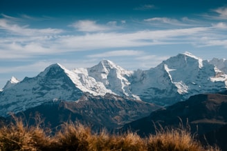 snow covered mountain under blue sky during daytime