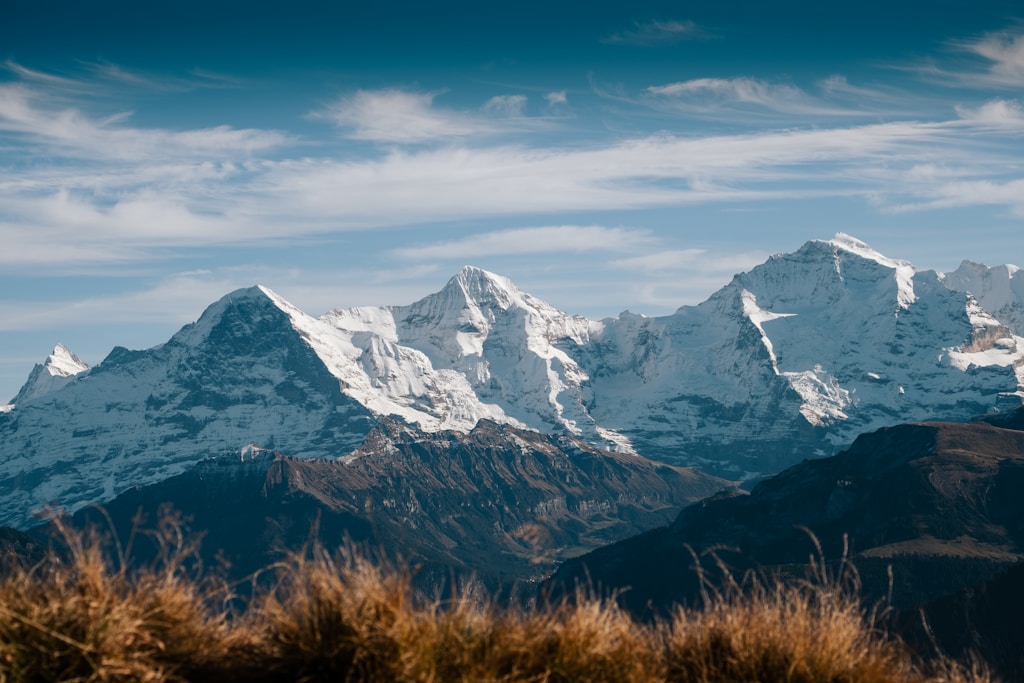 snow covered mountain under blue sky during daytime