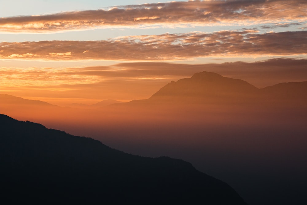 silhouette of mountains during sunset