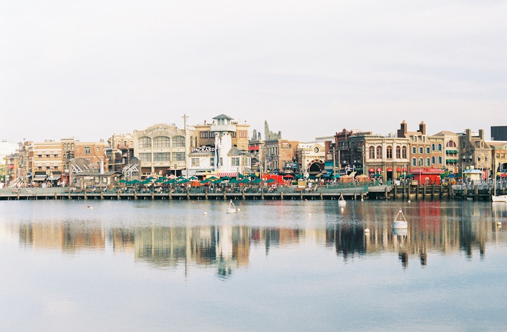 body of water near city buildings during daytime