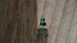 Close-up of modern agricultural machinery working on soil preparation