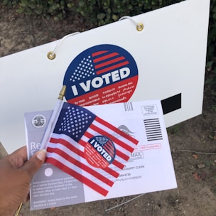 person holding white and red box