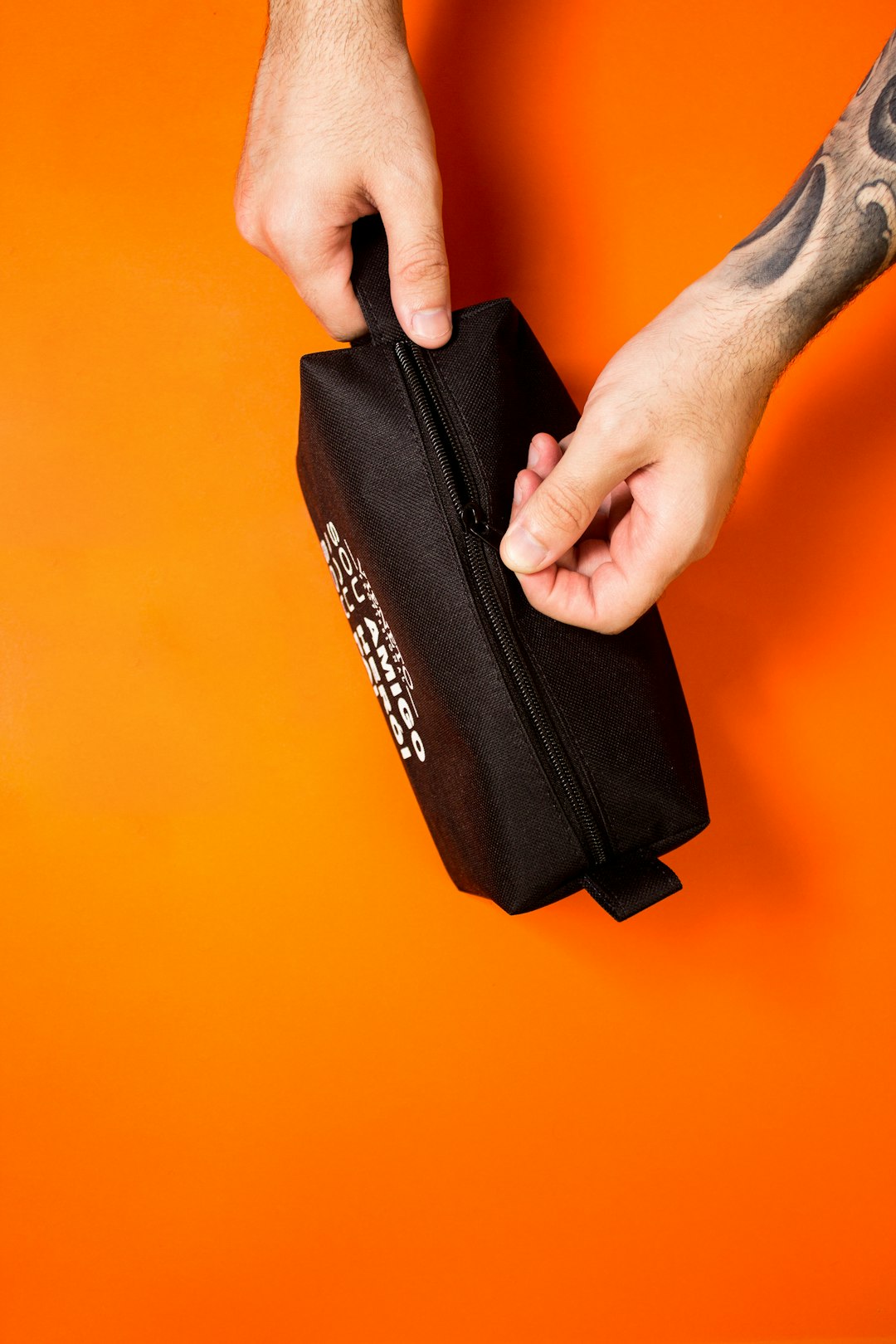 black and orange zip pouch