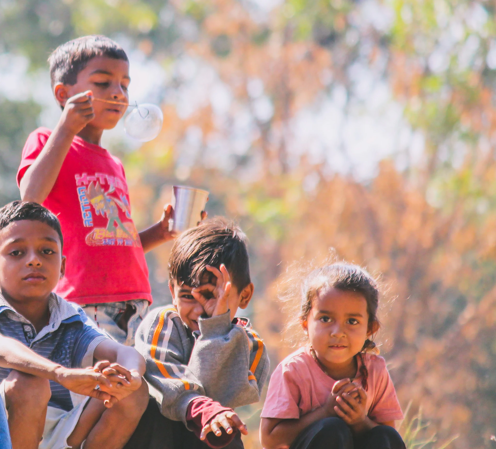 children playing on field during daytime