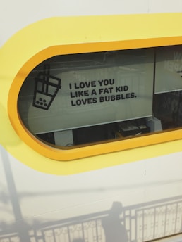 A window with a yellow border displays a humorous message alongside an illustration of a bubble tea drink.