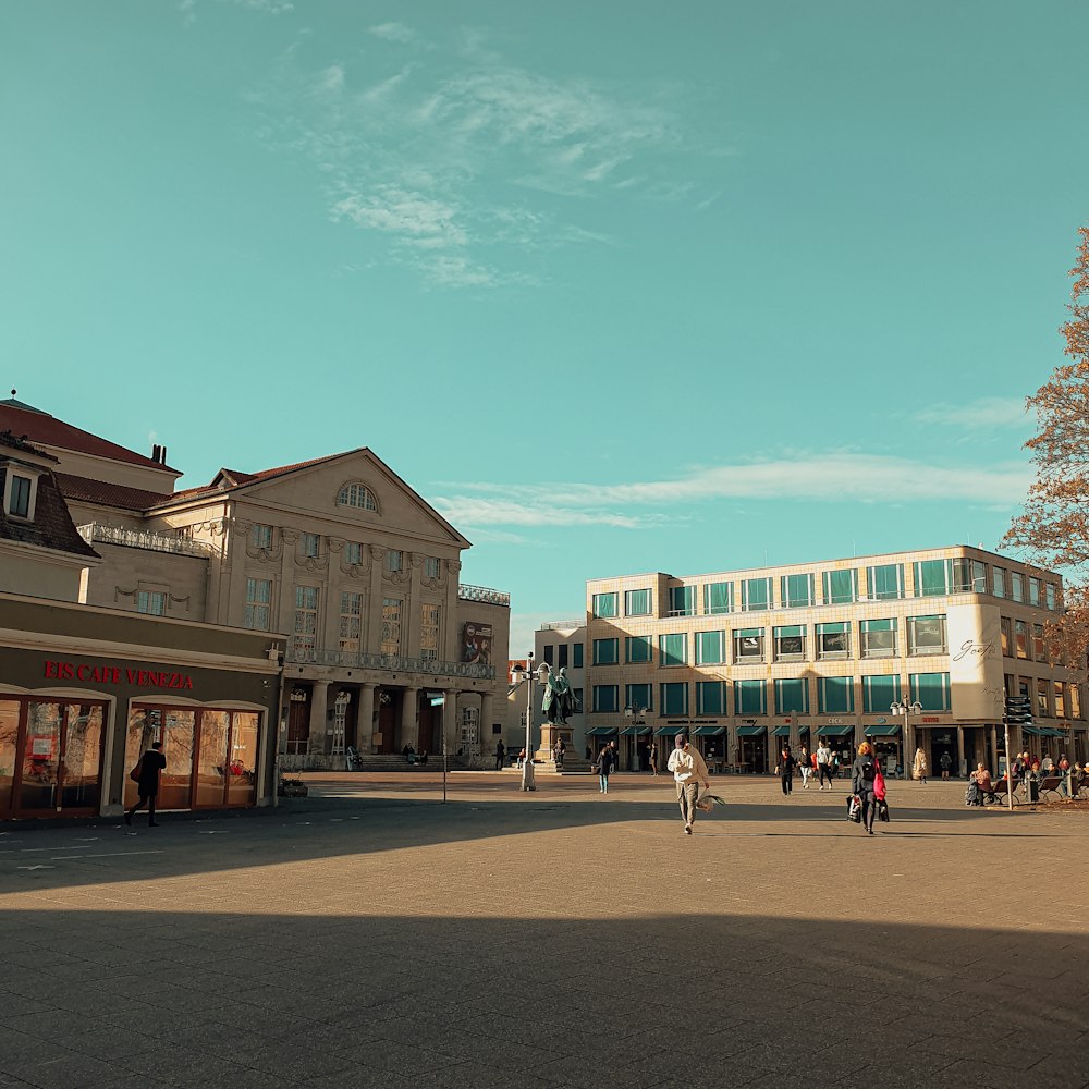 people walking on street near buildings during daytime