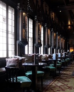 Elegant, softly lit venue with cozy seating arranged for intimate conversations among attendees.