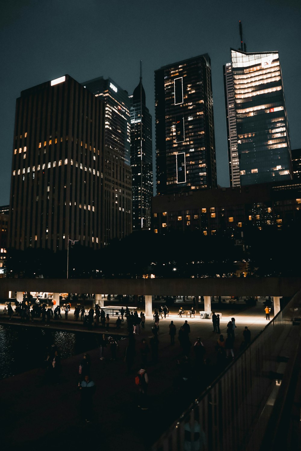 people walking on street during night time