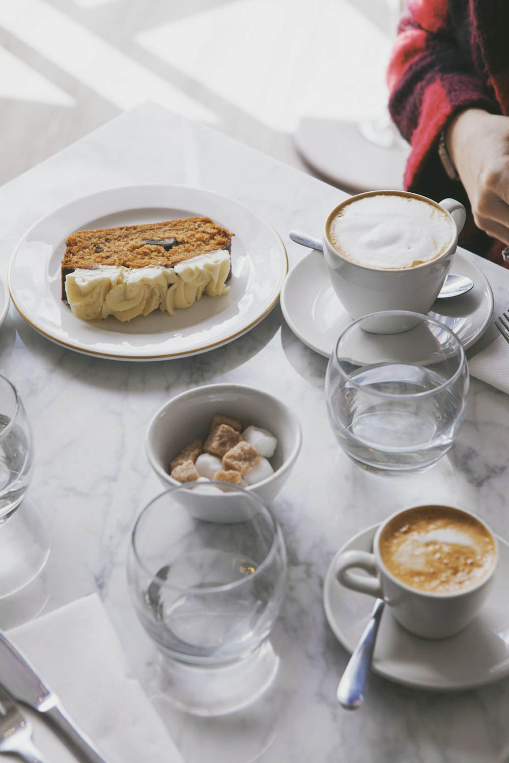 white ceramic bowl on white ceramic round plate