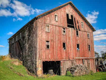 Wooden barn under a blue sky