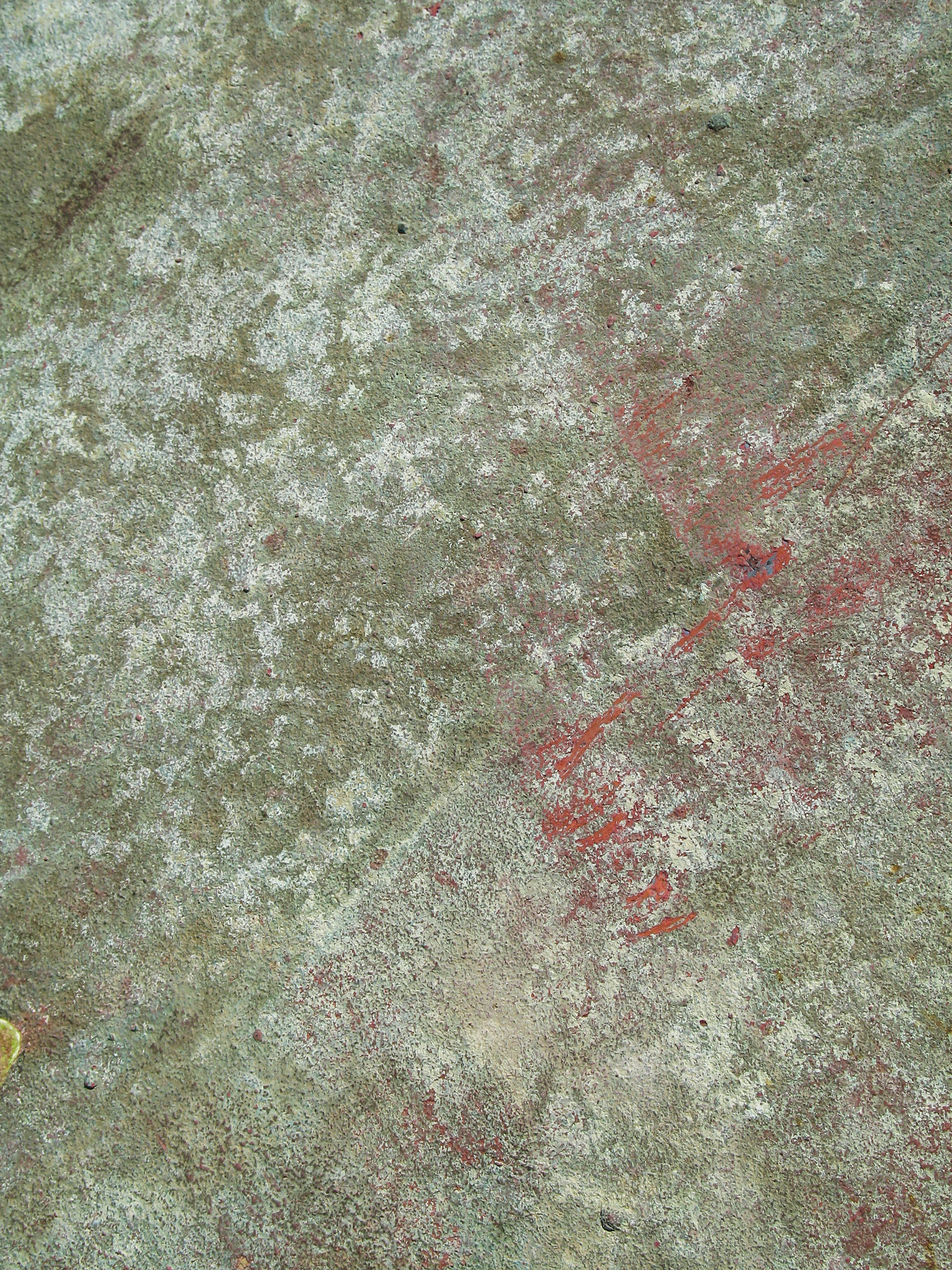 red and yellow powder on ground