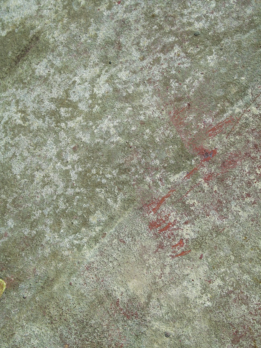 red and yellow powder on ground