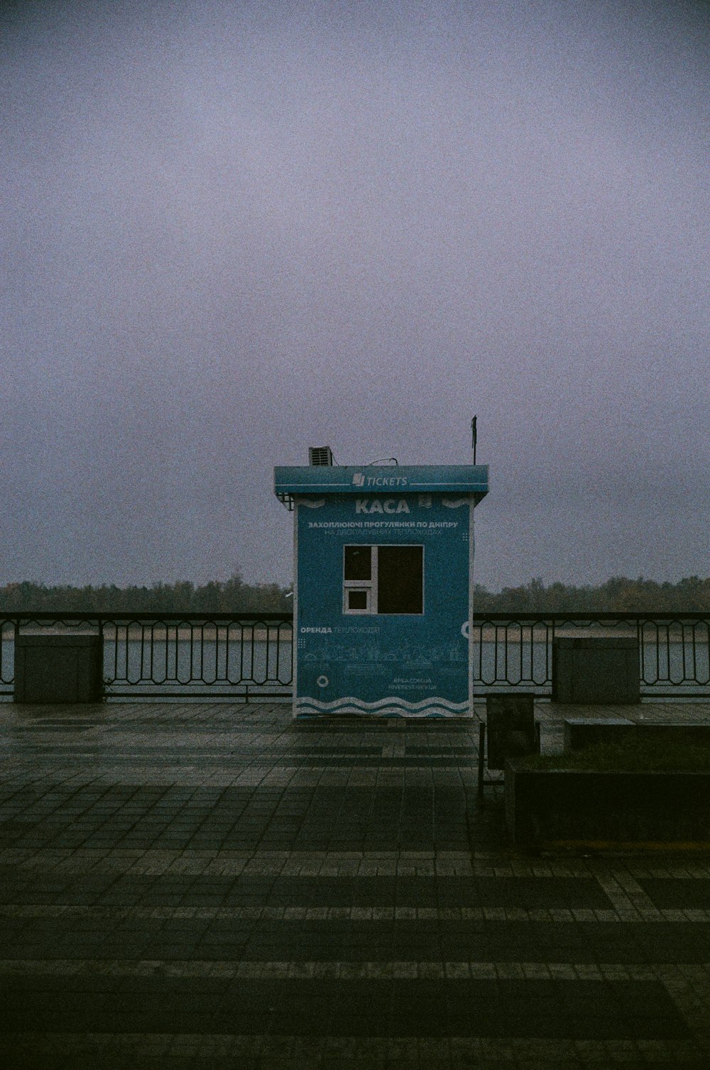 blue and white concrete building near body of water