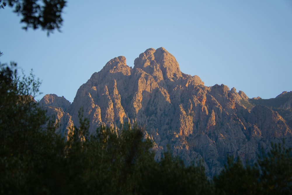 brown rocky mountain under blue sky during daytime