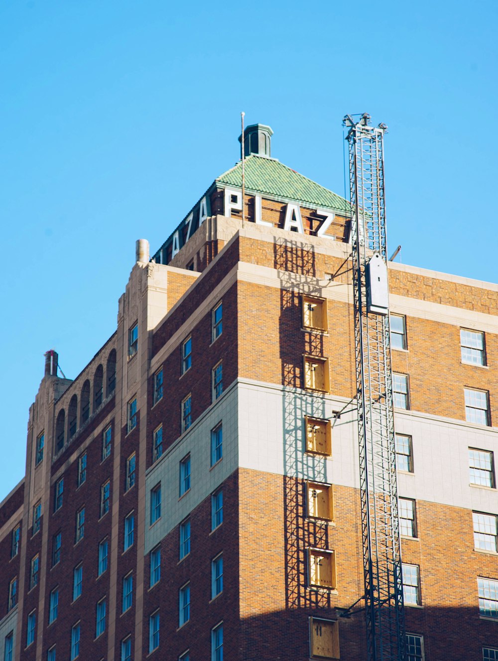 brown concrete building under blue sky during daytime