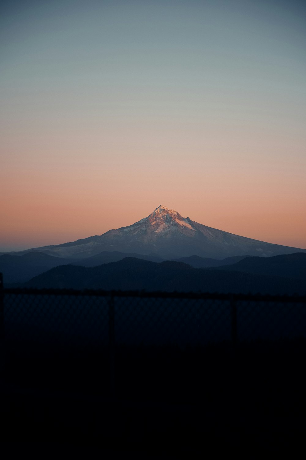 snow covered mountain during sunset