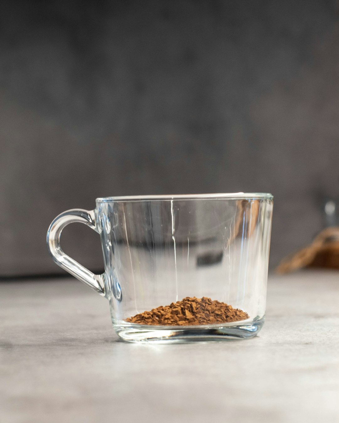 clear glass mug on white table