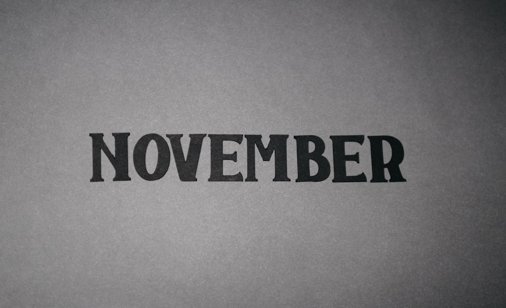 a black and white photo of the word november