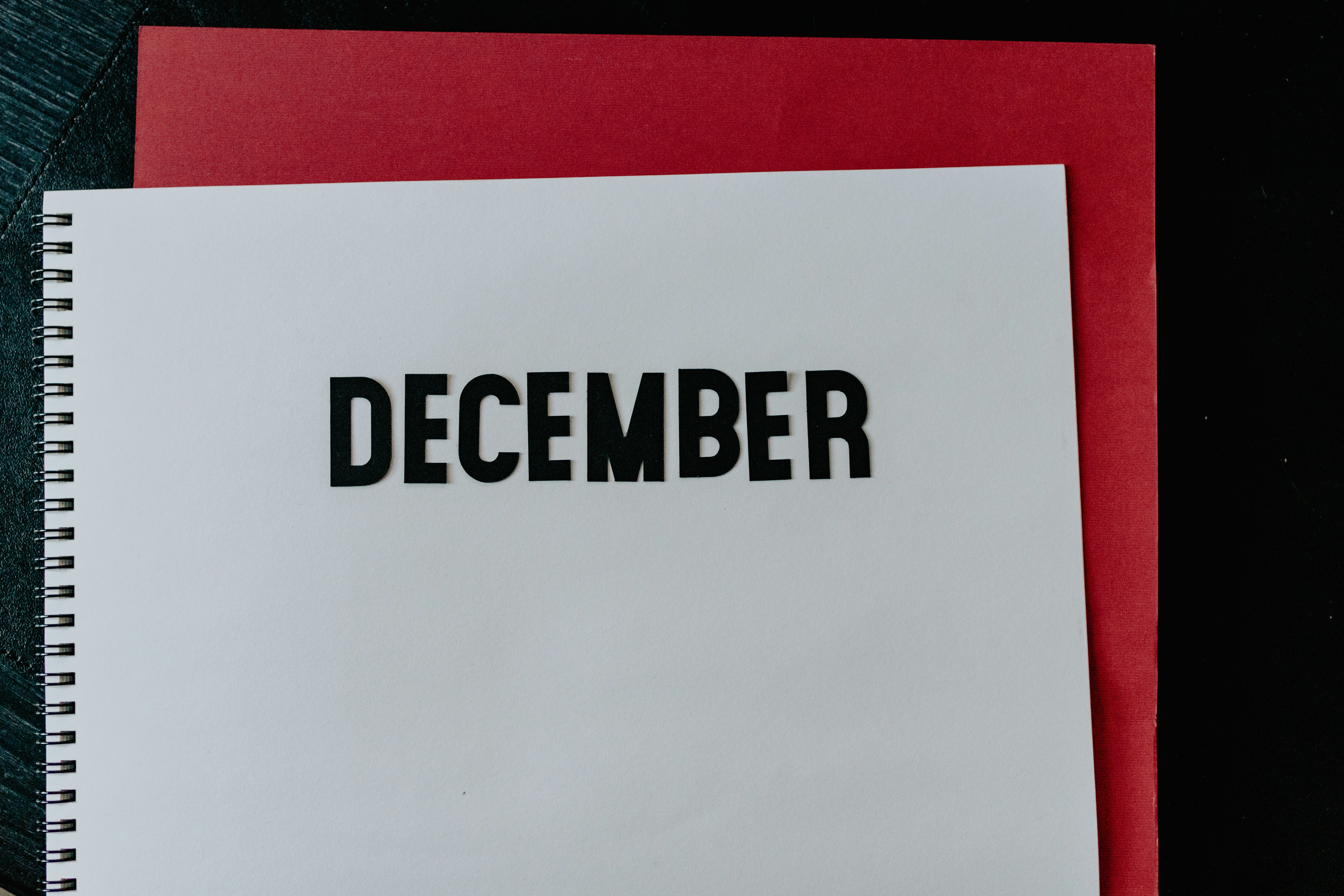 Paper cutout of December on a notebook