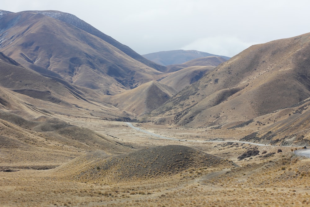 brown and gray mountains under white sky during daytime