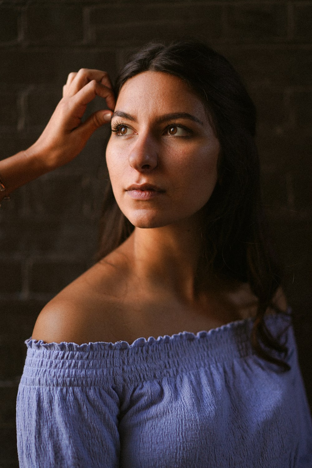 woman in blue off shoulder shirt