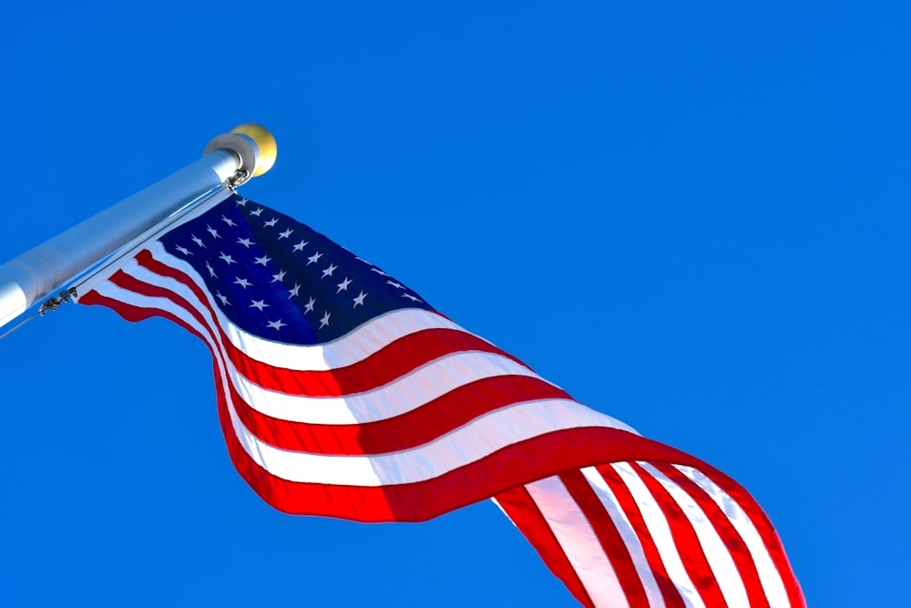 us a flag under blue sky during daytime